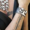 Silver color bracelet with reptile scales texture design