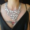 Silver color necklace with reptile scales texture design