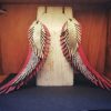 Light red earrings in the shape of angel wings - Image 2