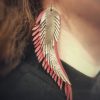 Light red earrings in the shape of angel wings - Image 3