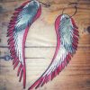 Light red earrings in the shape of angel wings - Image 6