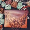 Brown shoulder bag, with abstract natural motifs