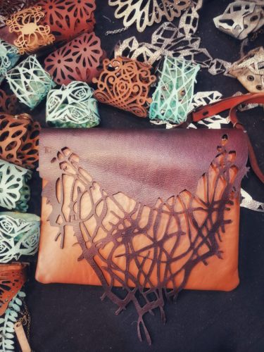 Brown shoulder bag, with abstract natural motifs
