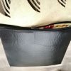 Red and black shoulder bag with organic texture flap - Image 7