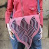 Red and black shoulder bag with organic texture flap