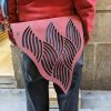 Red and black shoulder bag with organic texture flap - Image 5