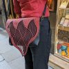 Red and black shoulder bag with organic texture flap - Image 3